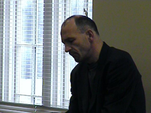 Bertho Driever listens to a student's performance. [Dallas Recorder Society workshop and concert with the Amsterdam Loeki Stardust Recorder Quartet - Dallas, TX, Feb. 28-29, 2004]